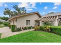 Beautiful one-story home with well-maintained landscaping, a covered entry and a two car garage at 4505 Kingsmere # 2, Sarasota, FL 34235
