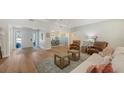 Spacious living room featuring hardwood floors, recessed lighting, and a neutral color palette at 4665 Pine Harrier Dr, Sarasota, FL 34231