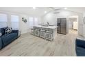 Bright kitchen featuring modern stainless steel appliances, quartz countertops, and ample seating at 55 Braden Castle Dr, Bradenton, FL 34208