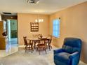 Charming dining room with a wooden table, chairs, and a decorative shelf, perfect for Gathering meals at 6110 Coral Way, Bradenton, FL 34207