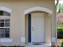 Close-up of the front door with white trim and a modern design at 7273 Cedar Hollow Cir # 102, Bradenton, FL 34203