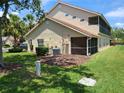 View of a home exterior with a screened in porch at 7273 Cedar Hollow Cir # 102, Bradenton, FL 34203