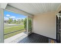 Relaxing screened front porch with wood flooring perfect for enjoying the outdoors at 7595 Berwick St, North Port, FL 34287
