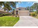 Charming two-story home with a well-maintained lawn, beautiful landscaping, and a two-car garage at 8222 Haven Harbour Way, Bradenton, FL 34212