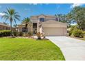 Charming two-story home with a well-maintained lawn, beautiful landscaping, and a two-car garage at 8222 Haven Harbour Way, Bradenton, FL 34212