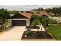 Aerial view of a single-story home with well-manicured lawn and landscaping at 11021 4Th E Ave, Bradenton, FL 34212