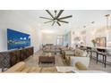 Spacious living room features modern furniture, large TV, and an open floor plan at 11427 Viani Ter, Palmetto, FL 34221
