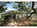The home's rear exterior features a porch at 129 Pierson Ln, Sarasota, FL 34242
