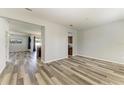 Spacious living room featuring modern flooring and an open layout, perfect for entertaining at 1721 Palm Warbler Ln, Ruskin, FL 33570