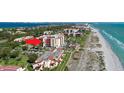 Aerial view of the condo building complex, showcasing its proximity to the beach at 2045 Gulf Of Mexico Dr # M1-514, Longboat Key, FL 34228