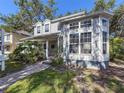 Lovely gray home showing a side view with a brick path and lots of windows at 2306 63Rd W St # 40, Bradenton, FL 34209