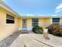 Charming home with a well-kept front yard and inviting walkway leading to the entrance at 264 E Tarpon Nw Blvd, Port Charlotte, FL 33952