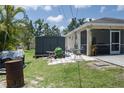 View of the backyard with shed and lawn equipment at 3411 15Th E St, Ellenton, FL 34222