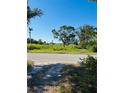 Street view of cleared lot ready for building near open water at 3601 Riverview Blvd, Bradenton, FL 34205