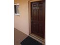 Condo entrance featuring a dark brown door with the number 203 displayed at 4154 Heron Way # 203B, Bradenton, FL 34205