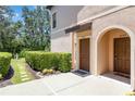 Cozy townhome entrance with a well-maintained walkway and lush greenery at 4220 Via Piedra Cir # 4-101, Sarasota, FL 34233