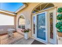 Welcoming front entry featuring a decorative glass door, sidelights, and a cozy seating area at 4585 Dover Street E Cir, Bradenton, FL 34203