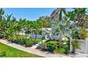 Landscaped home with mature trees and a well manicured lawn at 643 Calle Del Otono, Sarasota, FL 34242