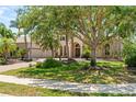 Elegant home with well-manicured front yard and brick driveway at 6808 Belmont Ct, Lakewood Ranch, FL 34202