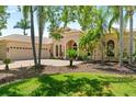 Attractive home featuring a tile roof, three-car garage, and verdant lawn at 6808 Belmont Ct, Lakewood Ranch, FL 34202