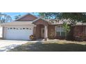 Charming single-story home featuring a two-car garage and a well-maintained front lawn at 7004 Mauna Loa Blvd, Sarasota, FL 34241