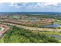 Beautiful aerial view of a community, golf course, lakes, and lush greenery at 13710 Messina Loop # 201, Bradenton, FL 34211