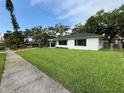 Charming one-story home featuring a spacious lawn and mature trees at 2333 22Nd S St, St Petersburg, FL 33712