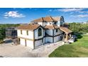 Charming home with a two car garage, paved driveway, and neatly kept lawn at 2400 Miguel Bay Dr, Terra Ceia, FL 34250