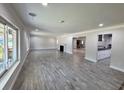 Bright and spacious living room boasting modern flooring and a cozy fireplace at 2720 12Th Ave W, Bradenton, FL 34205