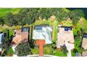 This aerial view highlights the house's location within a golf course community and its screened-in lanai at 2901 Little Country Rd, Parrish, FL 34219