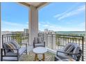 Relaxing outdoor balcony featuring comfortable seating and a stunning view of the city and water at 33 S Palm Ave # 1101, Sarasota, FL 34236