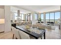 Bright, open-concept living space with modern finishes, floor-to-ceiling windows and water views at 33 S Palm Ave # 1101, Sarasota, FL 34236