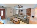 Inviting living room boasts a large sectional sofa, rustic wood accents, and stylish decor at 3417 49Th W St, Bradenton, FL 34209