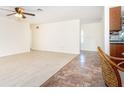 Open living space with two floor types, seamlessly blending a living area and kitchen views at 3585 Brooklyn Ave, Port Charlotte, FL 33952