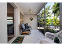 Relaxing screened patio with comfortable seating and lovely outdoor view at 3745 Almeria Ave # 7S, Sarasota, FL 34239