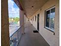 Exterior hallway of the building showcasing covered walkways and access to the unit at 3917 Lake Bayshore Dr # F-307, Bradenton, FL 34205