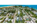 Aerial view of homes, showcasing the proximity to the ocean at 421 Alamanda Rd, Anna Maria, FL 34216