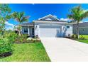 Attractive single-Gathering home boasting a lush green lawn, enhanced by landscaping and a spacious driveway at 4210 Sea Marsh Pl, Parrish, FL 34219