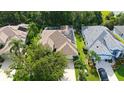A charming single-Gathering home features a private screened pool, solar panels, and a beautifully landscaped yard at 5044 Creekside Trl, Sarasota, FL 34243