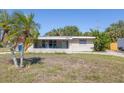 Exterior front view of a single story house with a lawn and showing the covered porch at 5705 23Rd W St, Bradenton, FL 34207