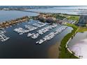 Aerial view of a well-maintained marina with numerous boats docked in an orderly fashion at 610 Riviera Dunes Way # 503, Palmetto, FL 34221
