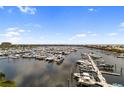 Expansive view of a marina filled with boats and yachts under a sunny sky at 610 Riviera Dunes Way # 503, Palmetto, FL 34221
