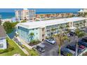 Charming condo building featuring well-maintained landscaping and convenient parking at 9200 Midnight Pass Rd # 30, Sarasota, FL 34242