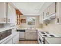Bright kitchen offering ample cabinet space, modern appliances, and a window with a pleasant view at 9200 Midnight Pass Rd # 30, Sarasota, FL 34242