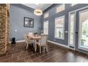 Formal dining room with natural light, neutral colored walls, and tile flooring at 932 Mangrove Edge Ct, Bradenton, FL 34208