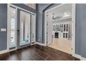 Inviting foyer with dark tile flooring, bright entry, and stylish interior doorway at 932 Mangrove Edge Ct, Bradenton, FL 34208