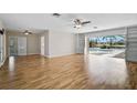 Spacious living room with hardwood floors and sliding doors that showcase the outdoor pool at 149 Small Se St, Port Charlotte, FL 33952