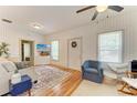 Inviting living room with wood floors, natural light, stylish furnishings, and ceiling fan at 2509 8Th W Ave, Bradenton, FL 34205