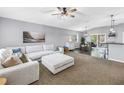 Spacious living room featuring a comfortable sectional sofa and a seamless open-concept design at 3162 27Th E Ct, Palmetto, FL 34221
