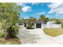 Charming single story home features well maintained landscaping, fresh white paint and modern black accents at 3808 Cape Vista Dr, Bradenton, FL 34209